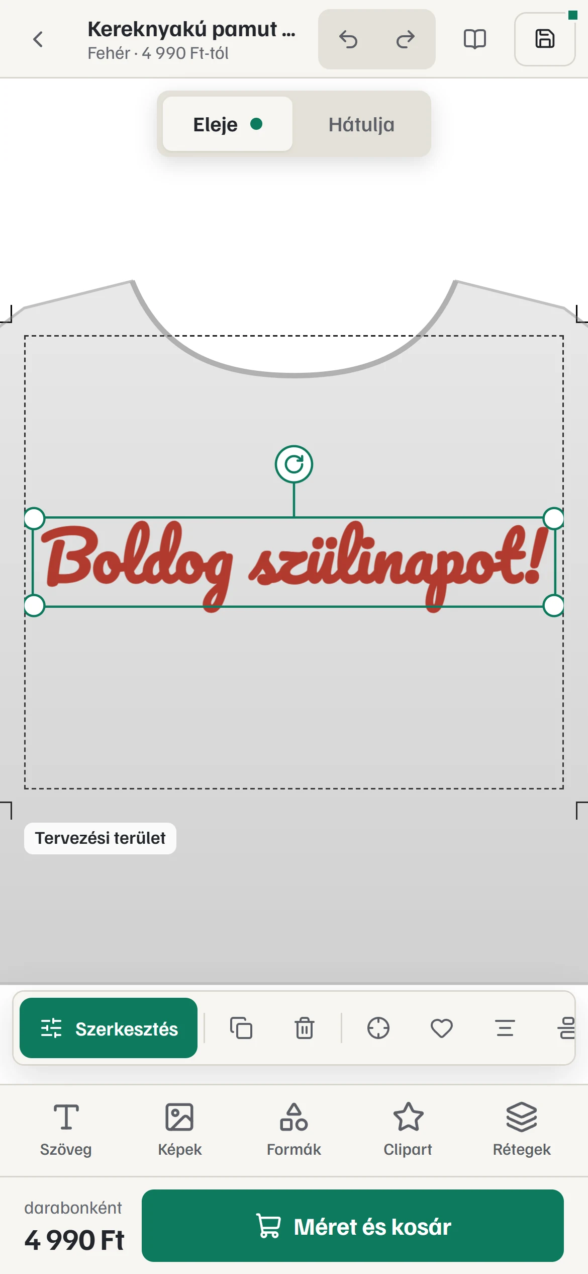 A tervező telefonon: a „Boldog szülinapot!” felirat a pólón, alatta a Szerkesztés sáv és a Méret és kosár gomb.